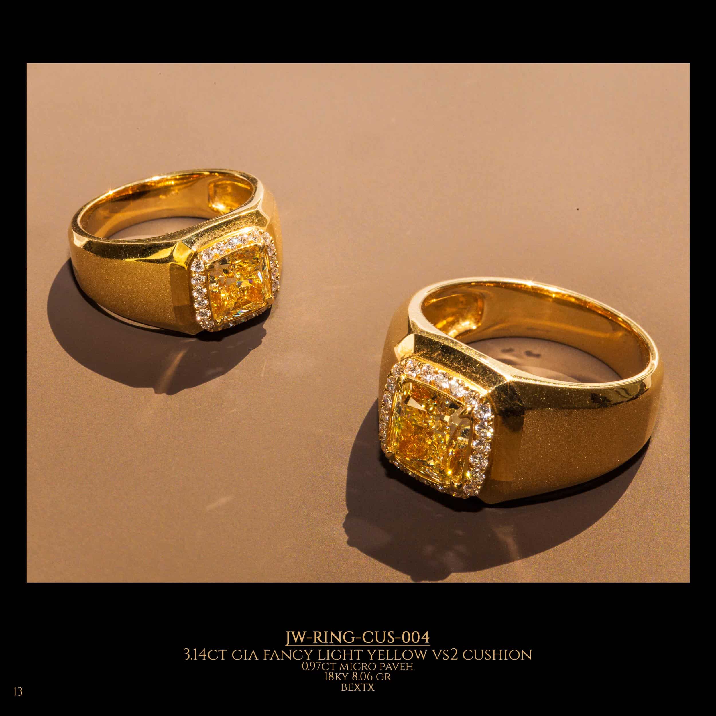 2 Yellow gold rings with a yellow diamond in the center surrounded by ordinary diamonds.