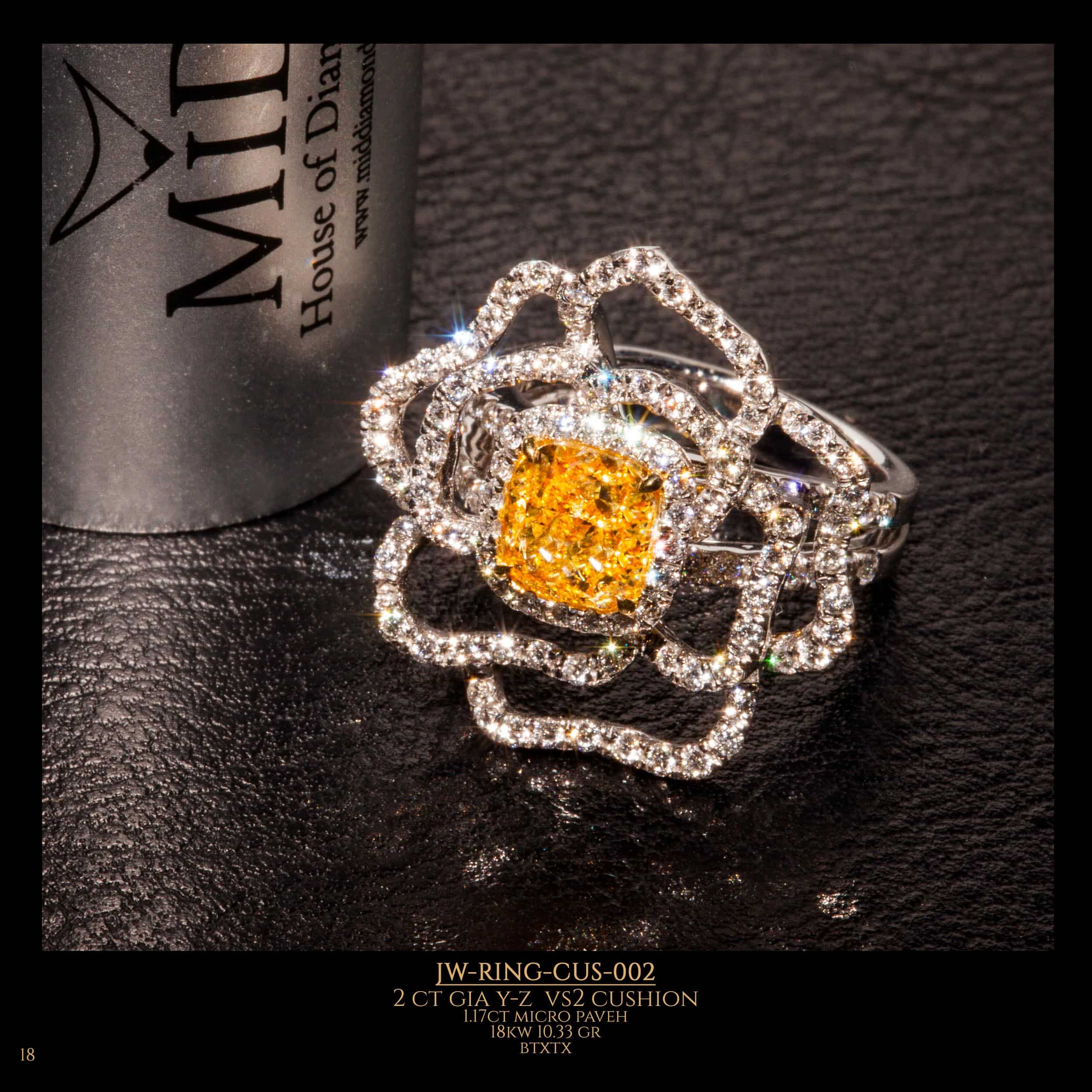 A flower-shaped GIA cushion diamond ring with a magnificent yellow diamond in the center