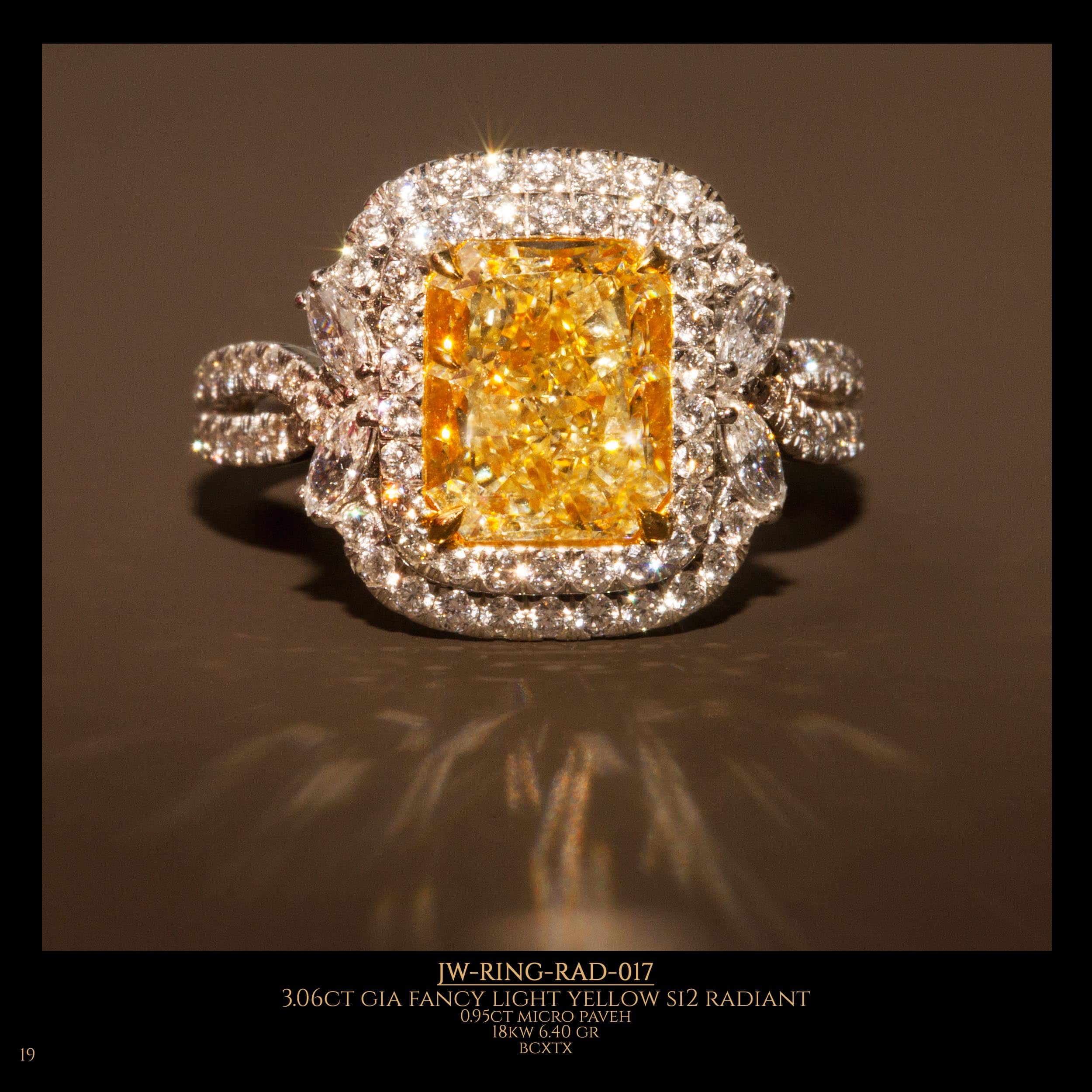 A special shape diamond ring with a magnificent fancy light yellow diamond in the center