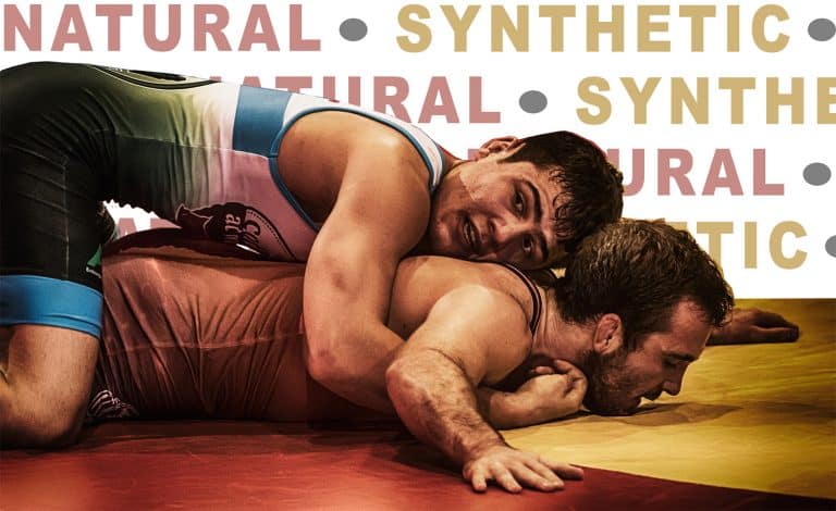 Two wrestlers grappling, “NATURAL” and “SYNTHETIC” text behind - cover image