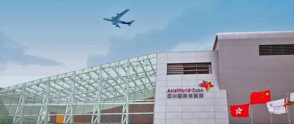 Airplane, flags, modern building at expo