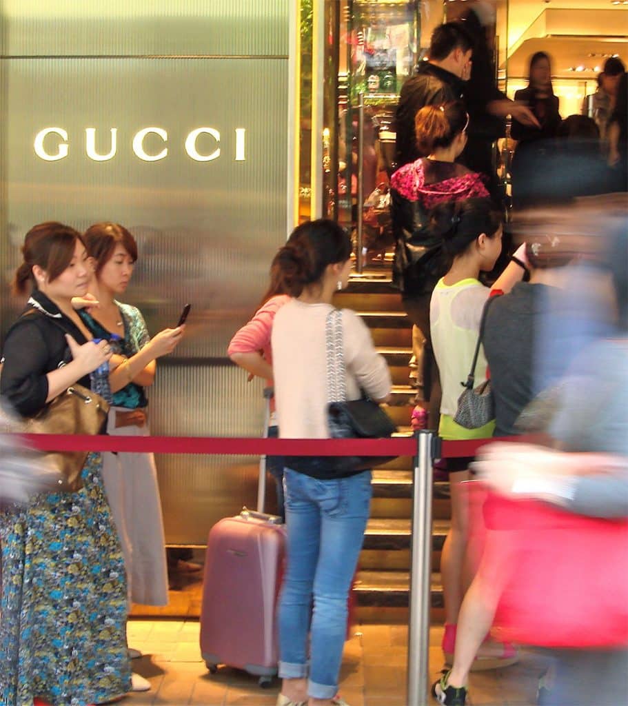 Chinese shoppers are standing in line for a Gucci store