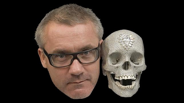 British artist Damien Hirst, posing alongside his sculptured skull, which was set with 8,601 diamonds