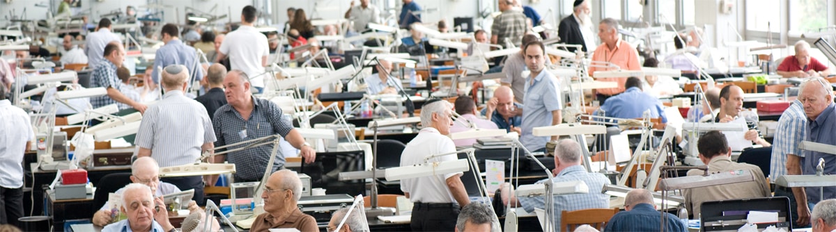Diamond traders center on the floor of the Israel Diamonds Exchange.