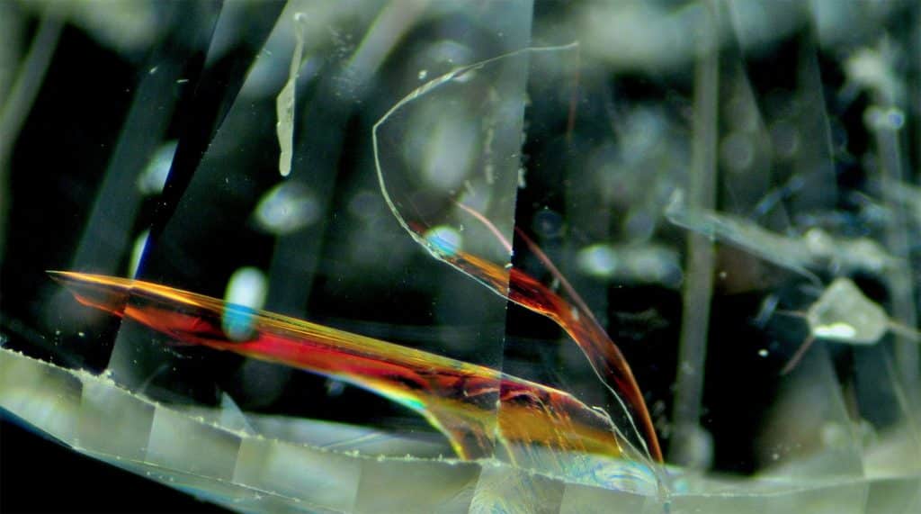 Rainbow flash effect indicating diamond fracture-filling clarity treatment.