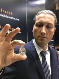 Michael Meirov CEO of MID holding a diamond