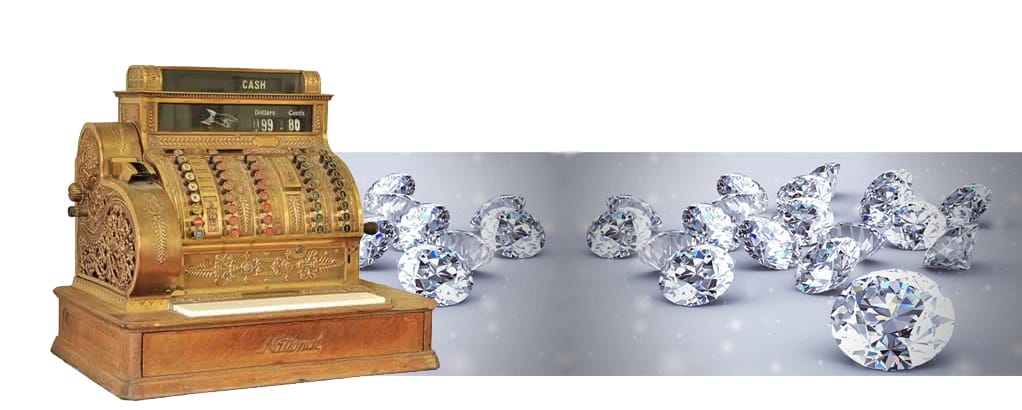 an antique cash register and several sparkling diamonds