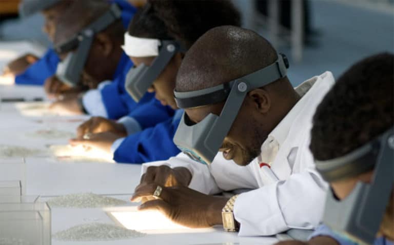Workers pick diamonds