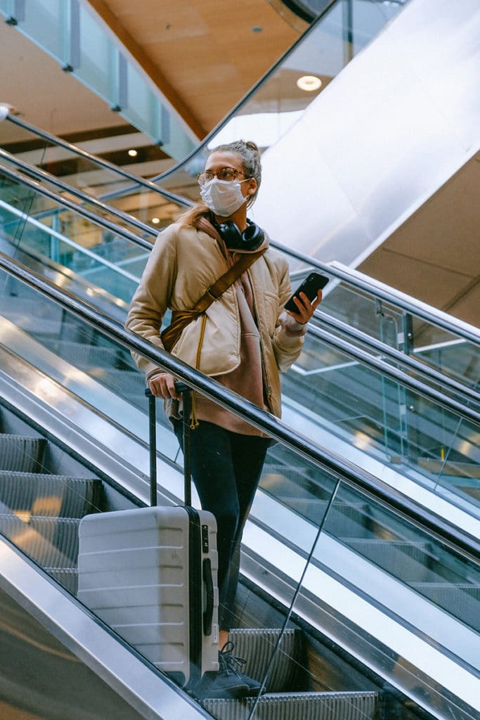 A woman with a mask at an airport