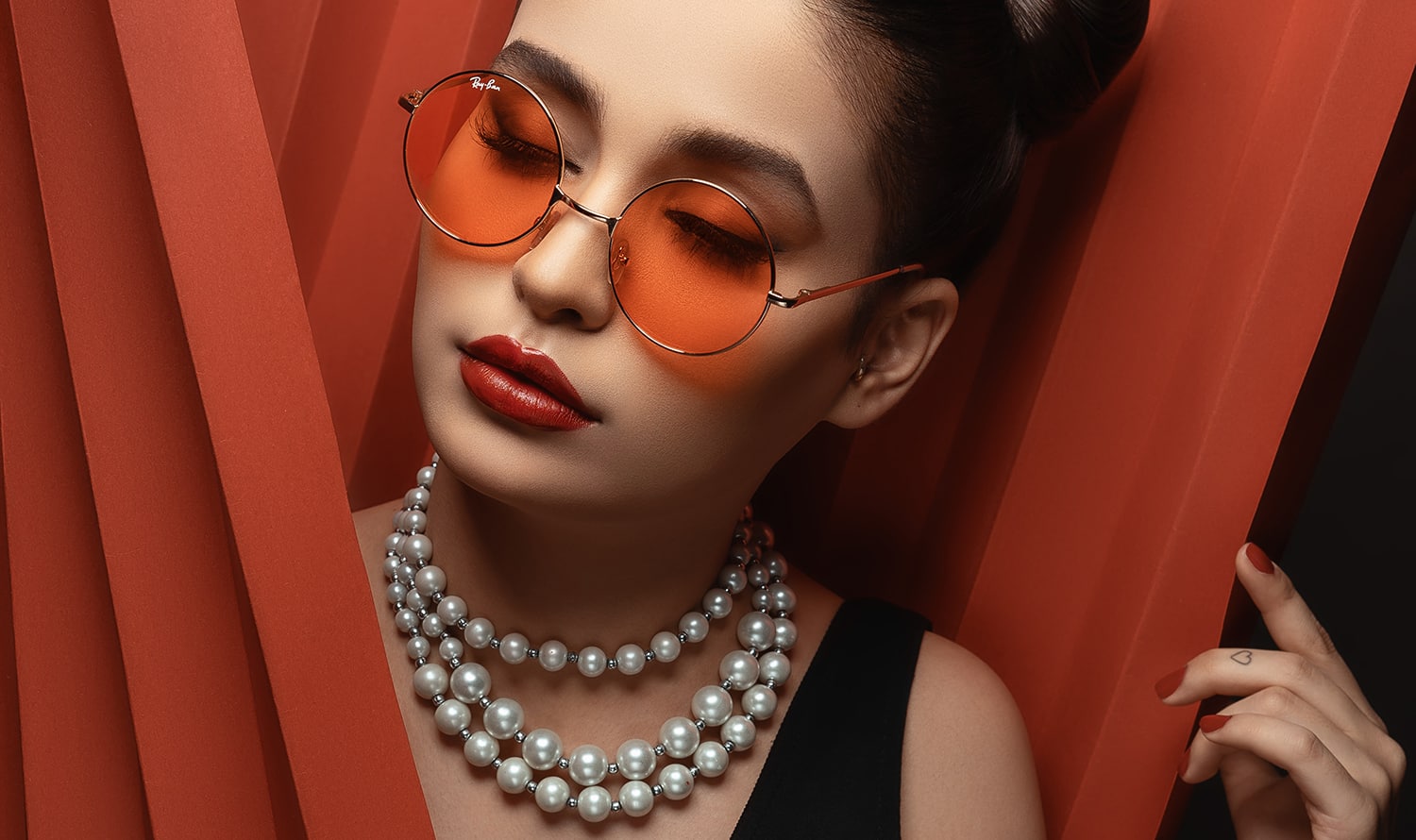 A woman wearing pearls